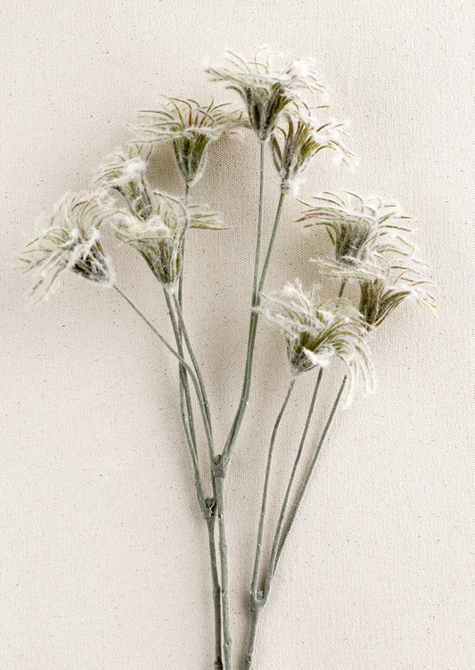 A faux clematis fuzzy bud spray.