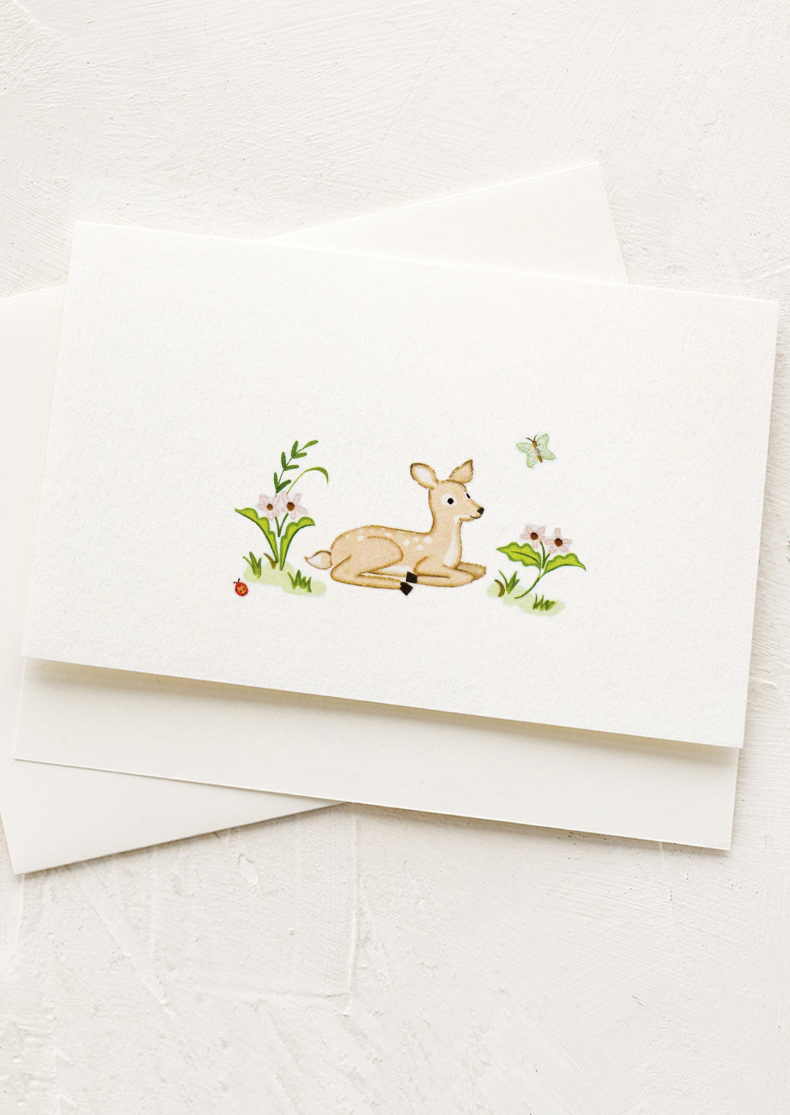 White card with a deer illustration on a white background