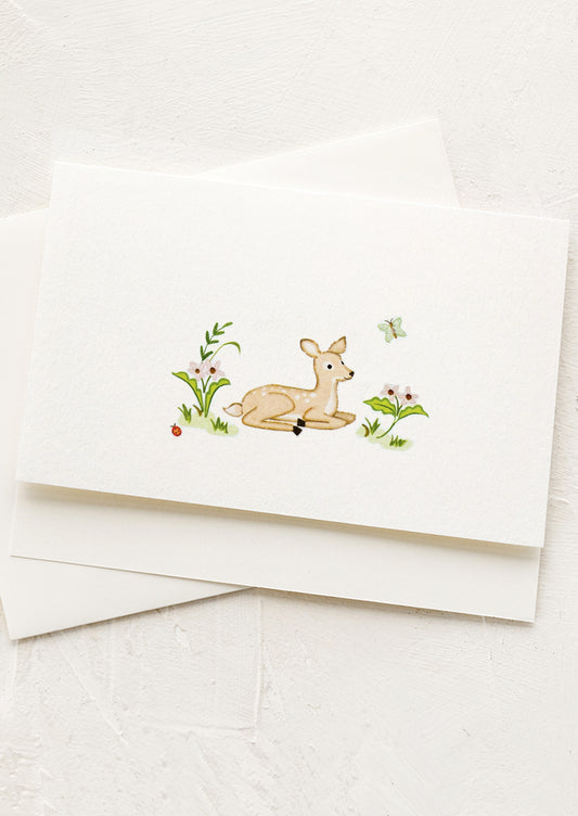 White card with a deer illustration on a white background
