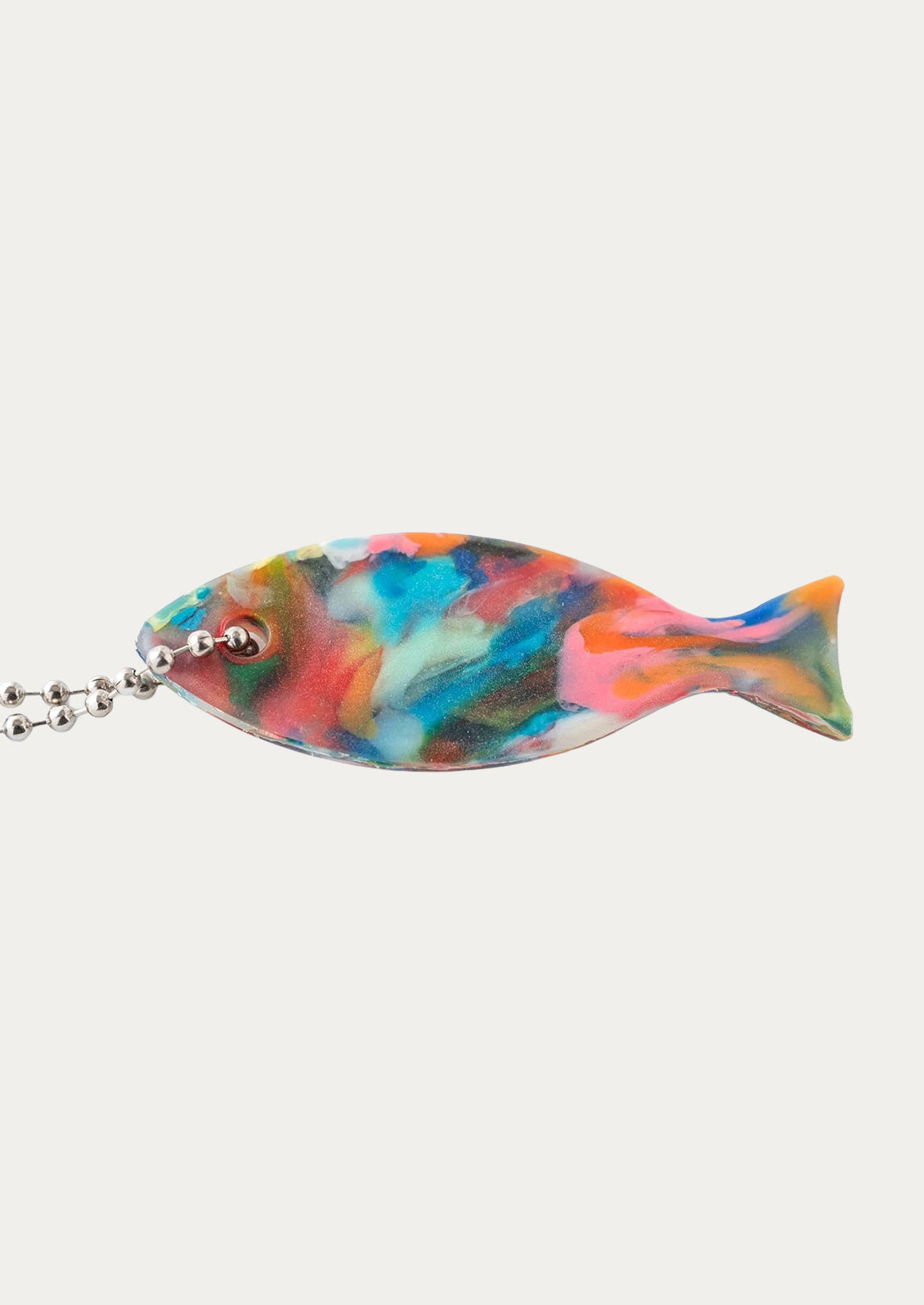 A colorful fish charm on a silver beaded chain.