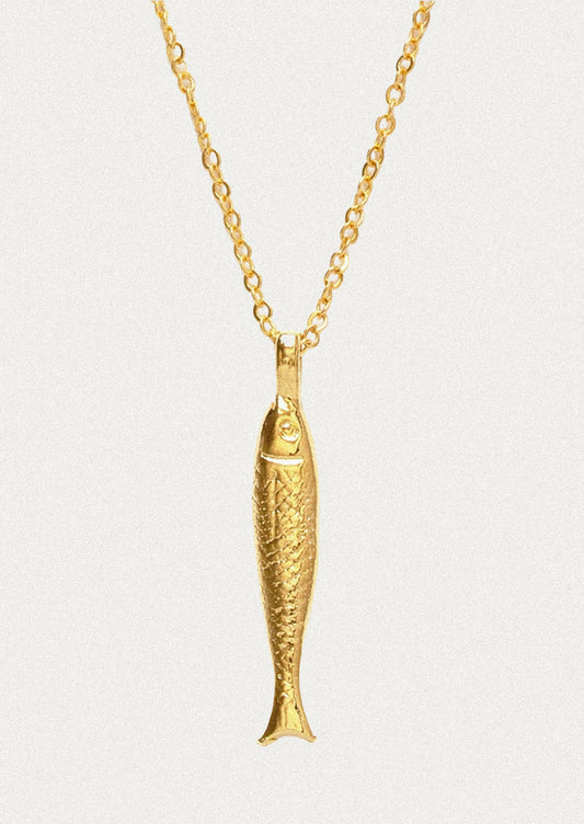A gold chain necklace with a fish charm.