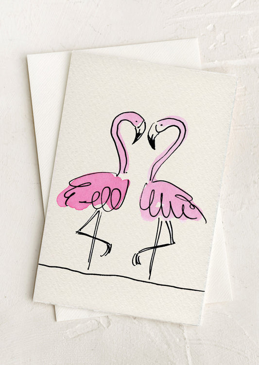 Two pink flamingo illustrations on a white background