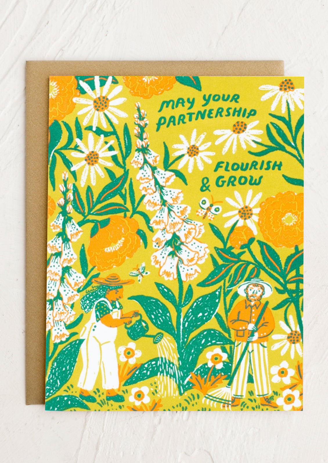 A card with floral print reading "May your partnership flourish & grow".