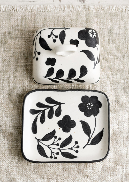 A black and white floral print butter dish.