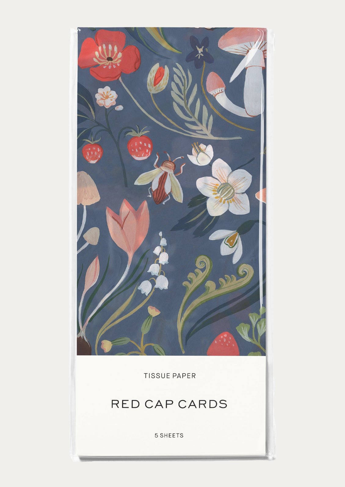 Tissue paper packaging with blue mushroom pattern.