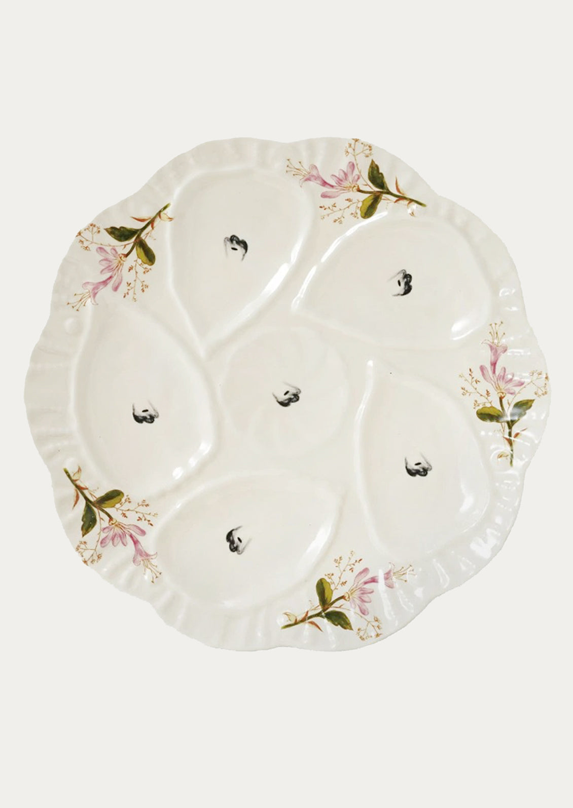 Decorative ceramic plate with floral patterns on a white background
