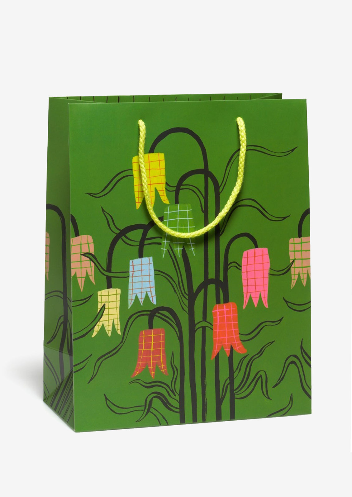 Green gift bag with colorful floral design and yellow handle.