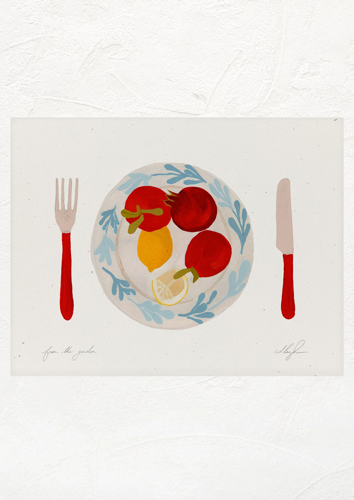 An art print of tomatoes and lemons on a plate with red knife and fork.