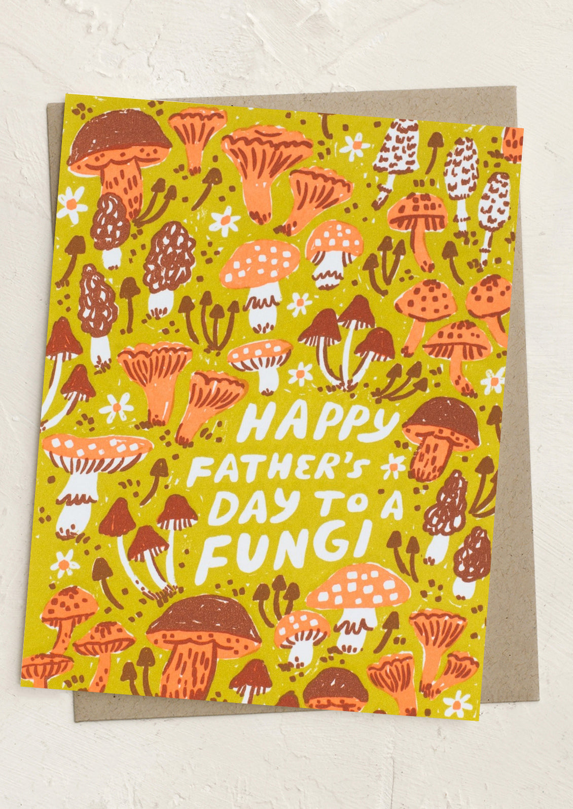 Father's Day card with mushroom design and text on a yellow background