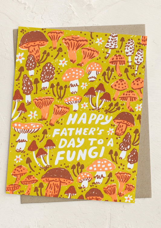 Father's Day card with mushroom design and text on a yellow background