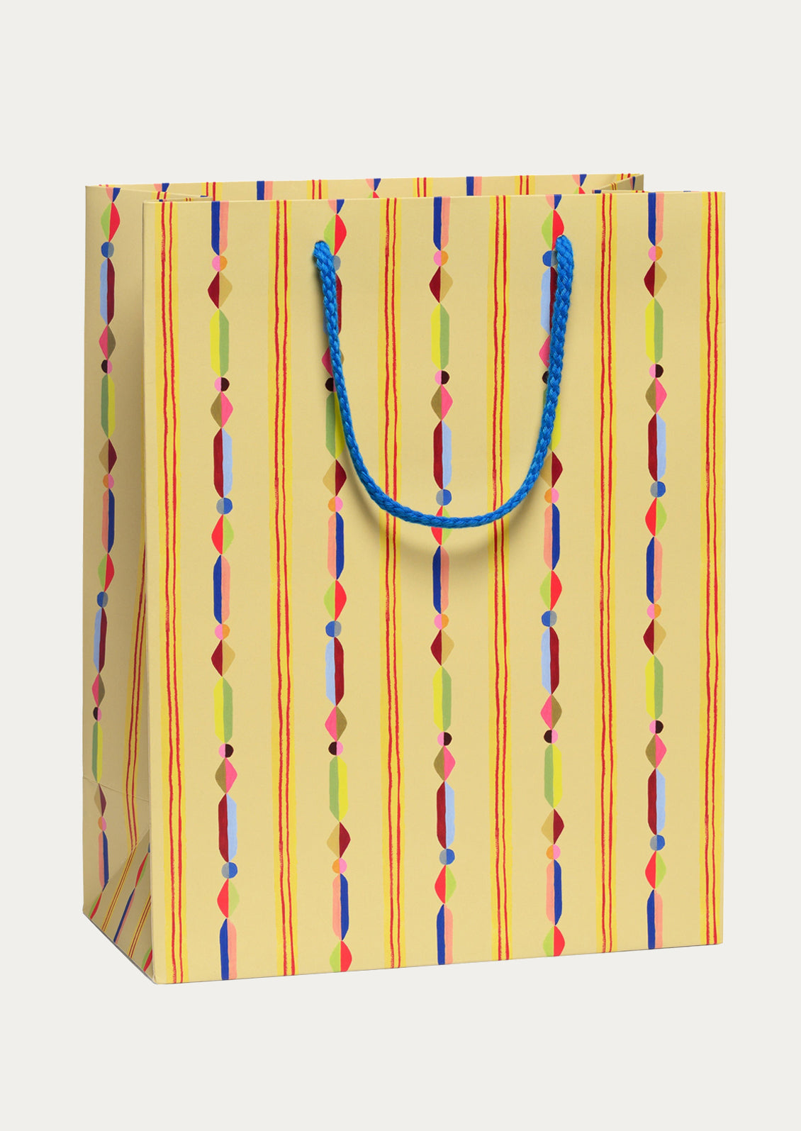 Colorful striped paper bag with a blue handle on a white background