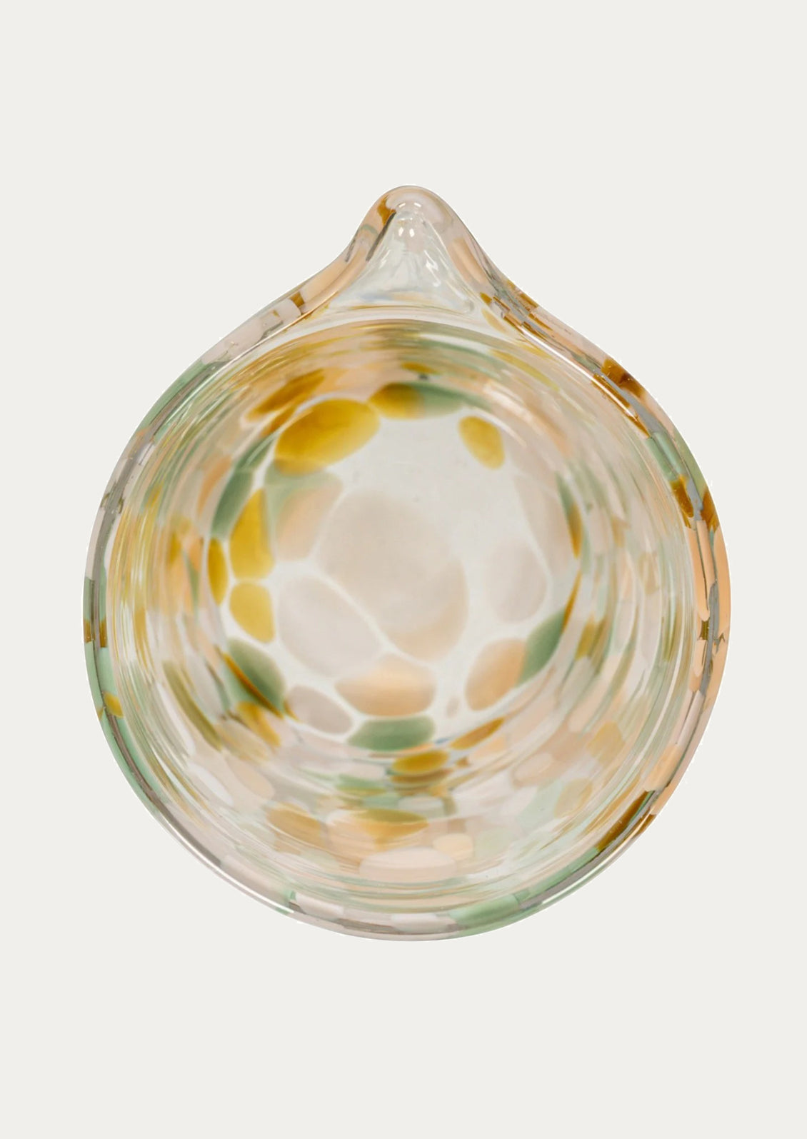 Glass bowl with swirling patterns on a white background
