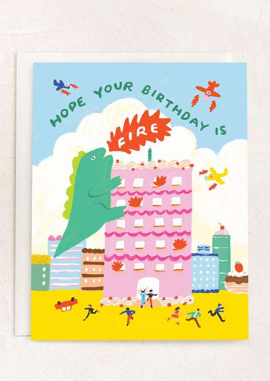 A card with illustration of Godzilla, text reads "Hope your birthday is Fire".