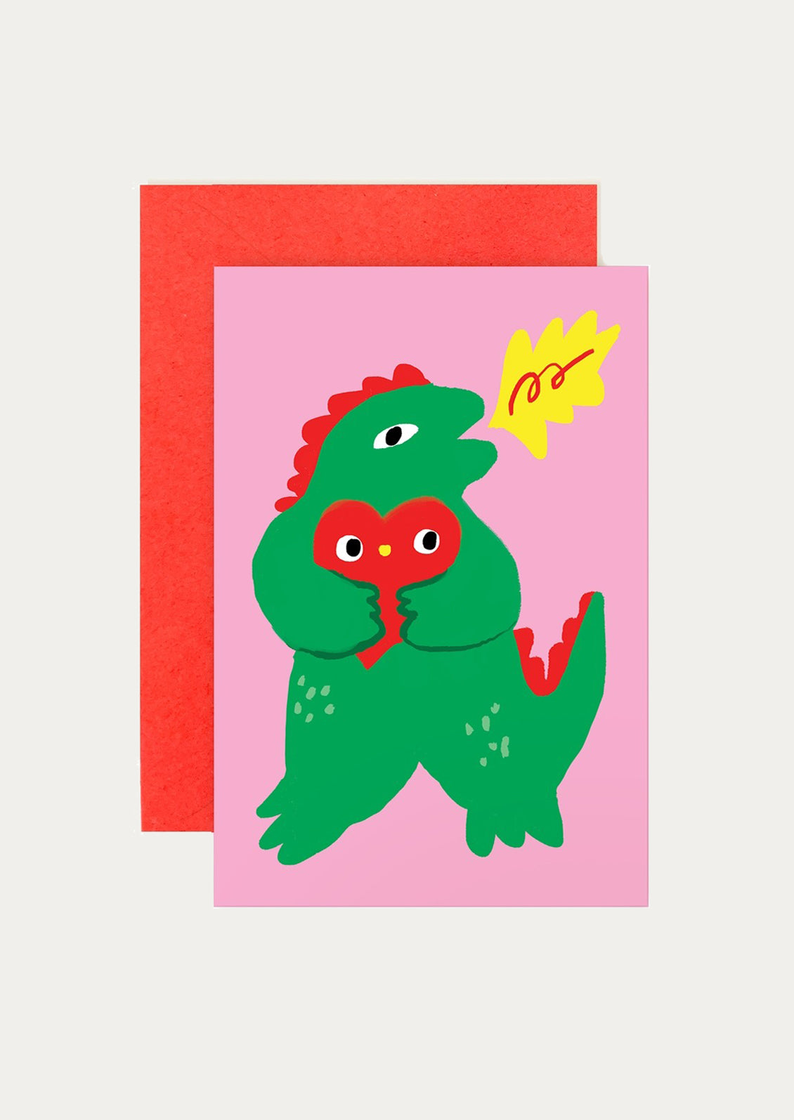 Card with a green dinosaur illustration on a pink background
