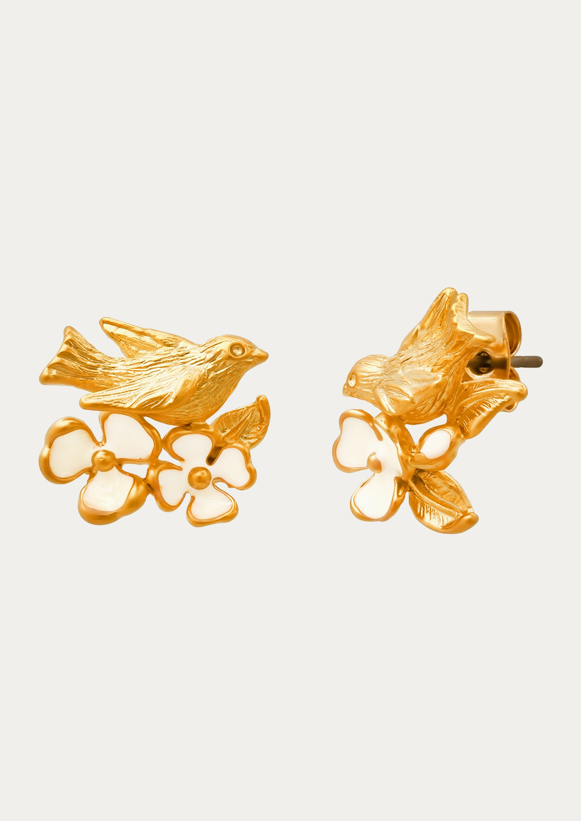 A pair of gold earrings adorned with a goldcrest bird and flowers.