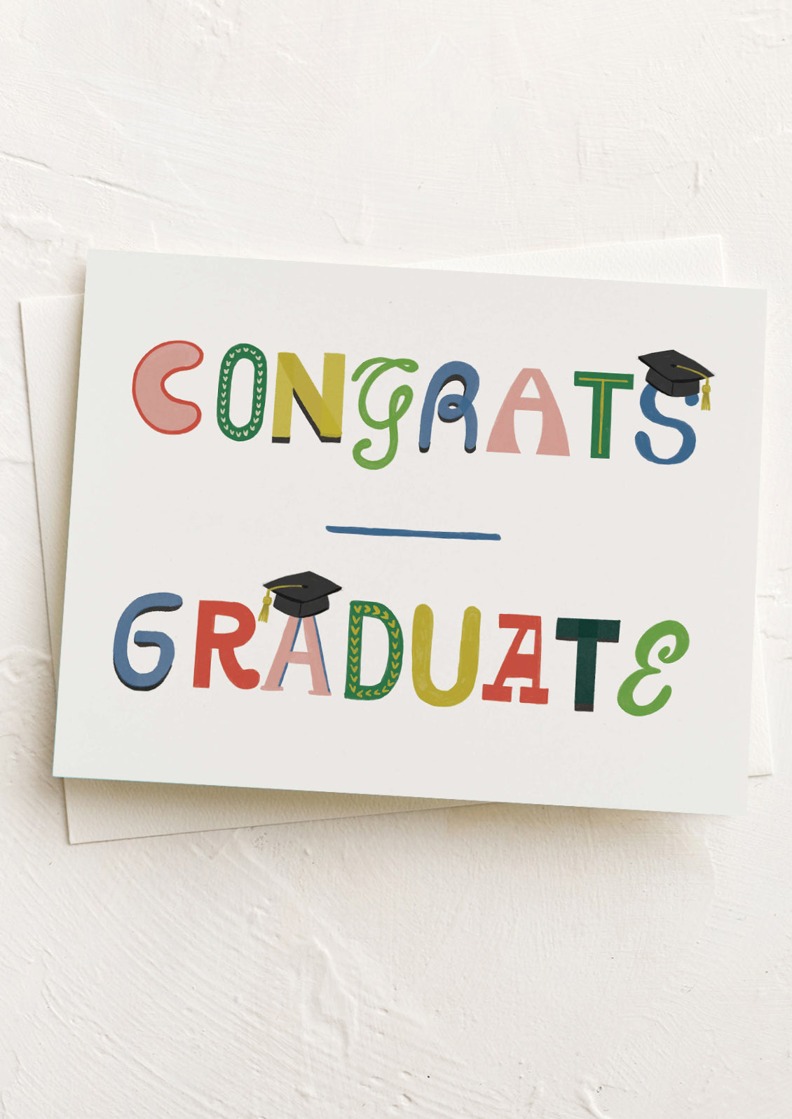 Graduation-themed card with colorful text on a white background