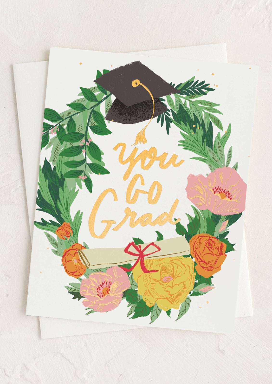 Graduation-themed card with flowers, cap, and 'You Go Grad!' text on a white background