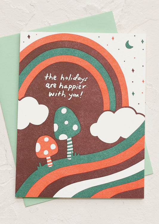 A greeting card reading "The Holidays Are Happier With You!".