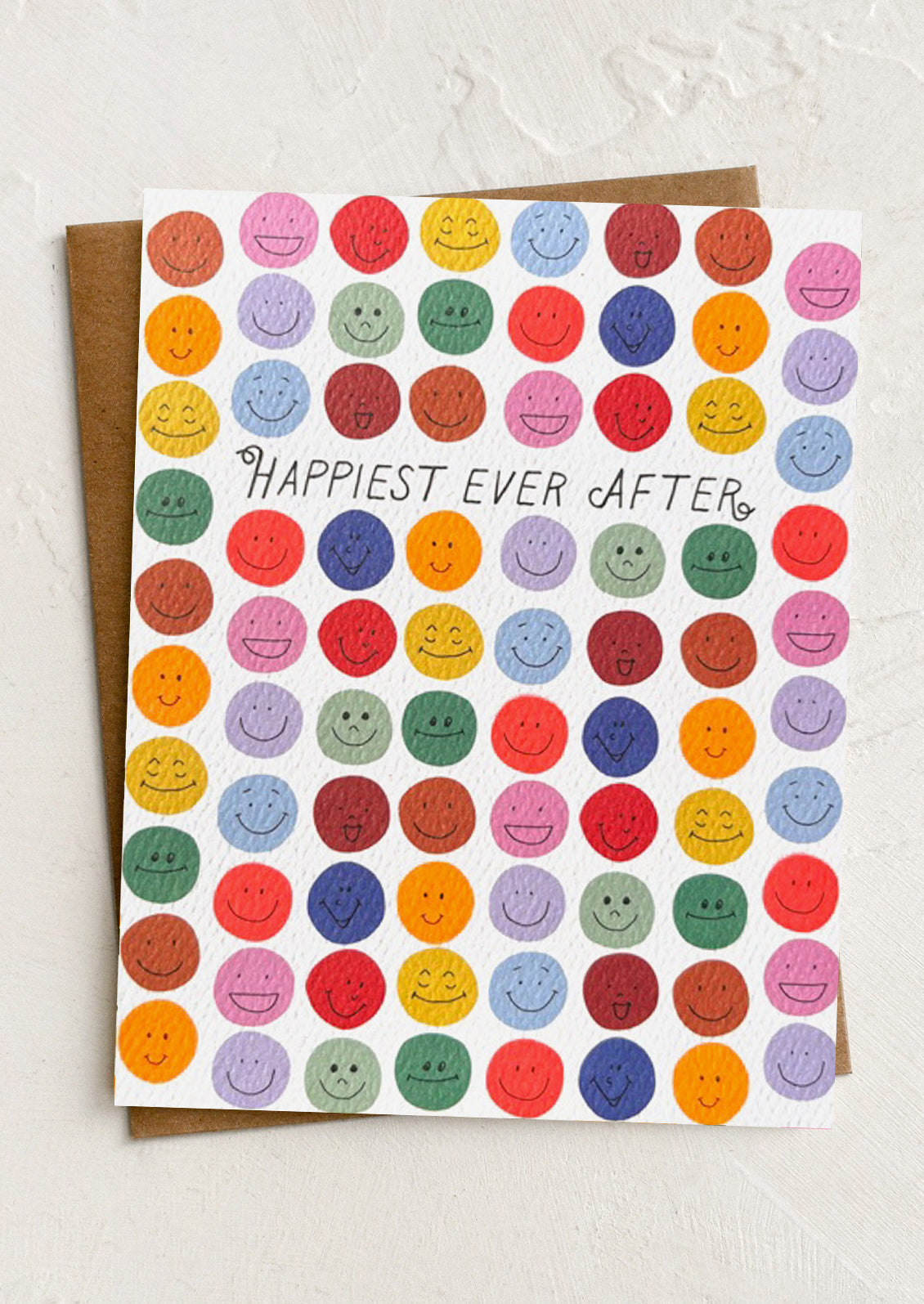 Card with colorful smiley faces and 'Happiest Ever After' text on a white background