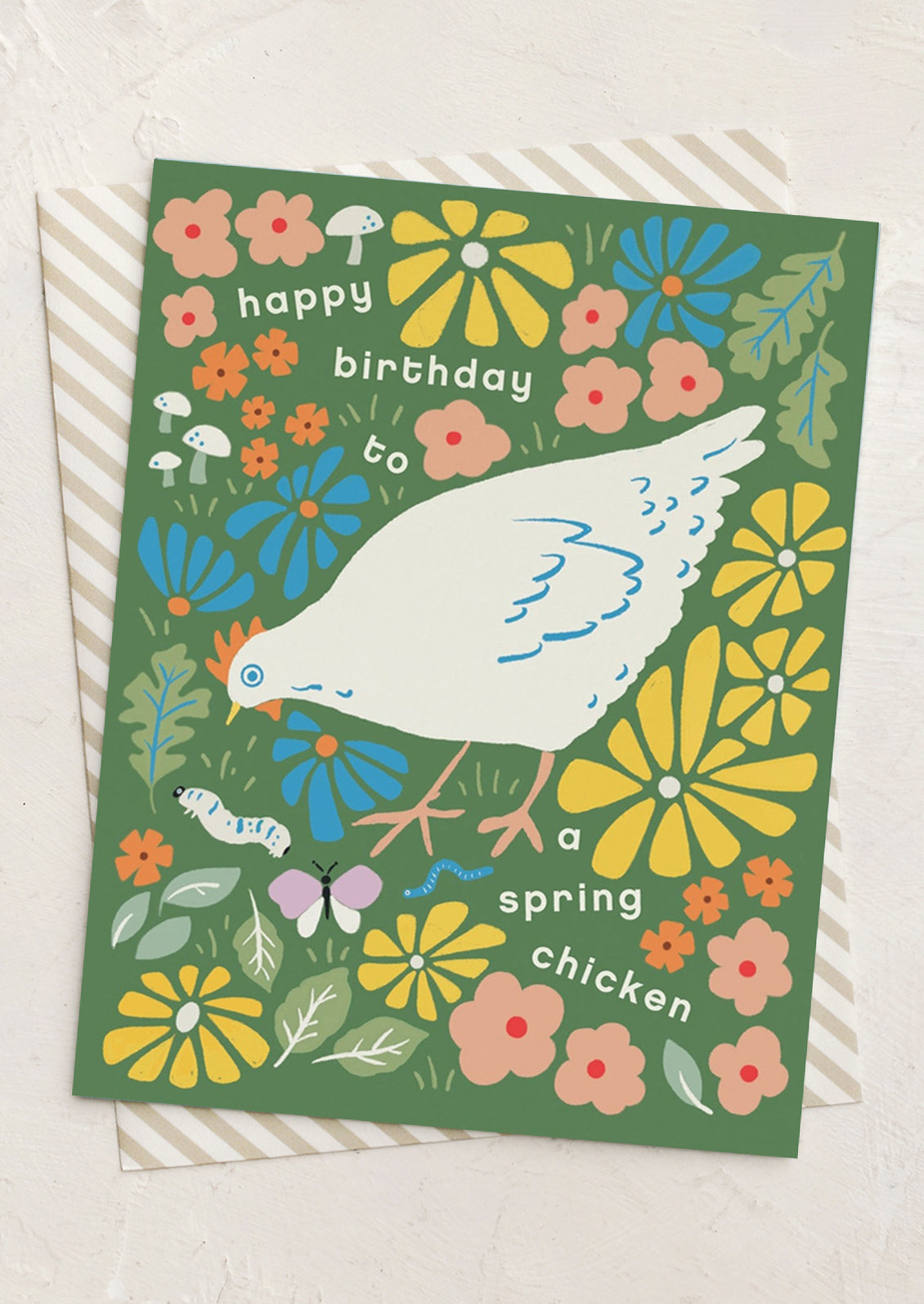 A greeting card with illustration of chicken, text reads "Happy birthday to a spring chicken".