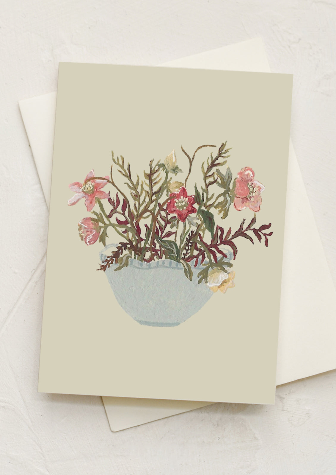 A mini greeting card with illustration of mixed hellebore arrangement in bowl.