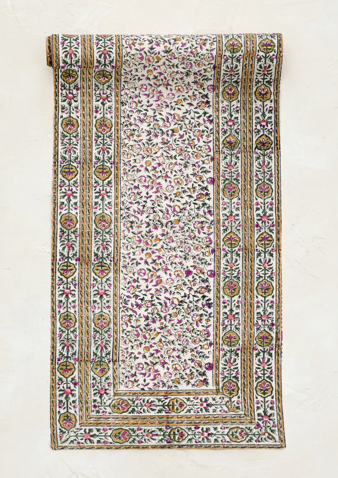 Decorative fabric with intricate patterns on a white background