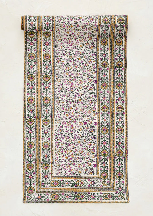 Decorative fabric with intricate patterns on a white background