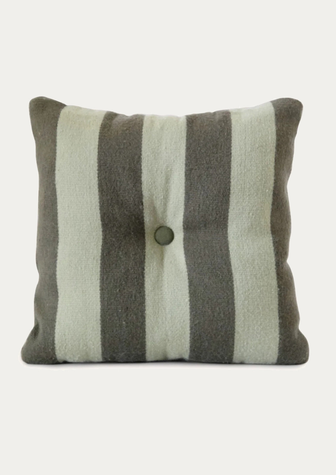 A striped pillow in mint and grey green with tufted button detail at center.