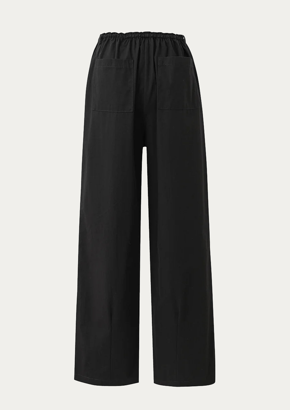 A pair of black cotton straight leg pants with drawstring waistband.