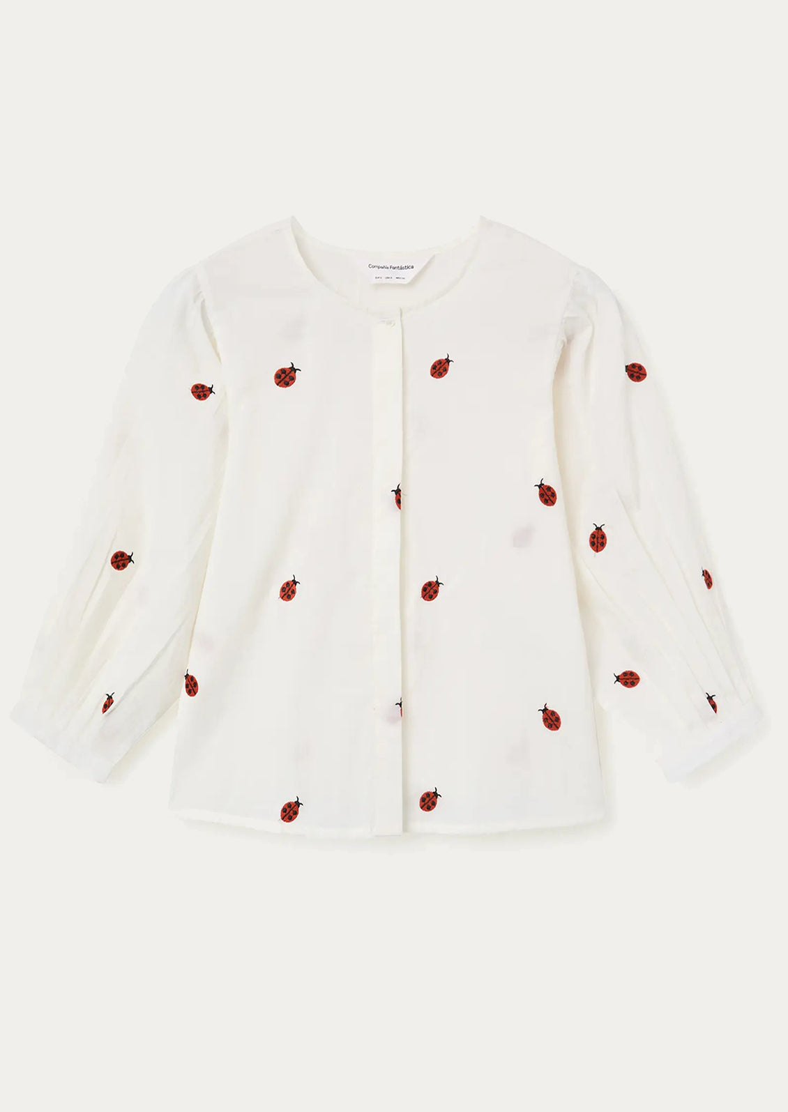 White shirt with red berry patterns on a white background
