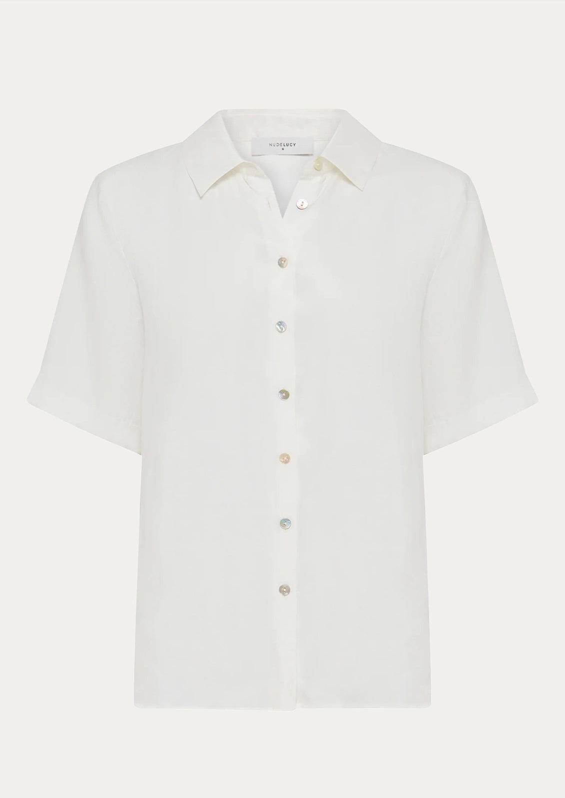 A draped short sleeve button up shirt in white.