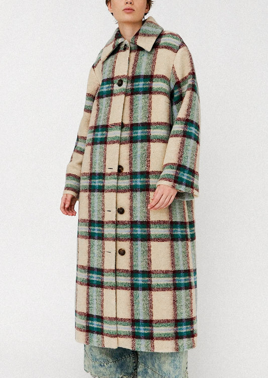 Person wearing a plaid coat on a white background
