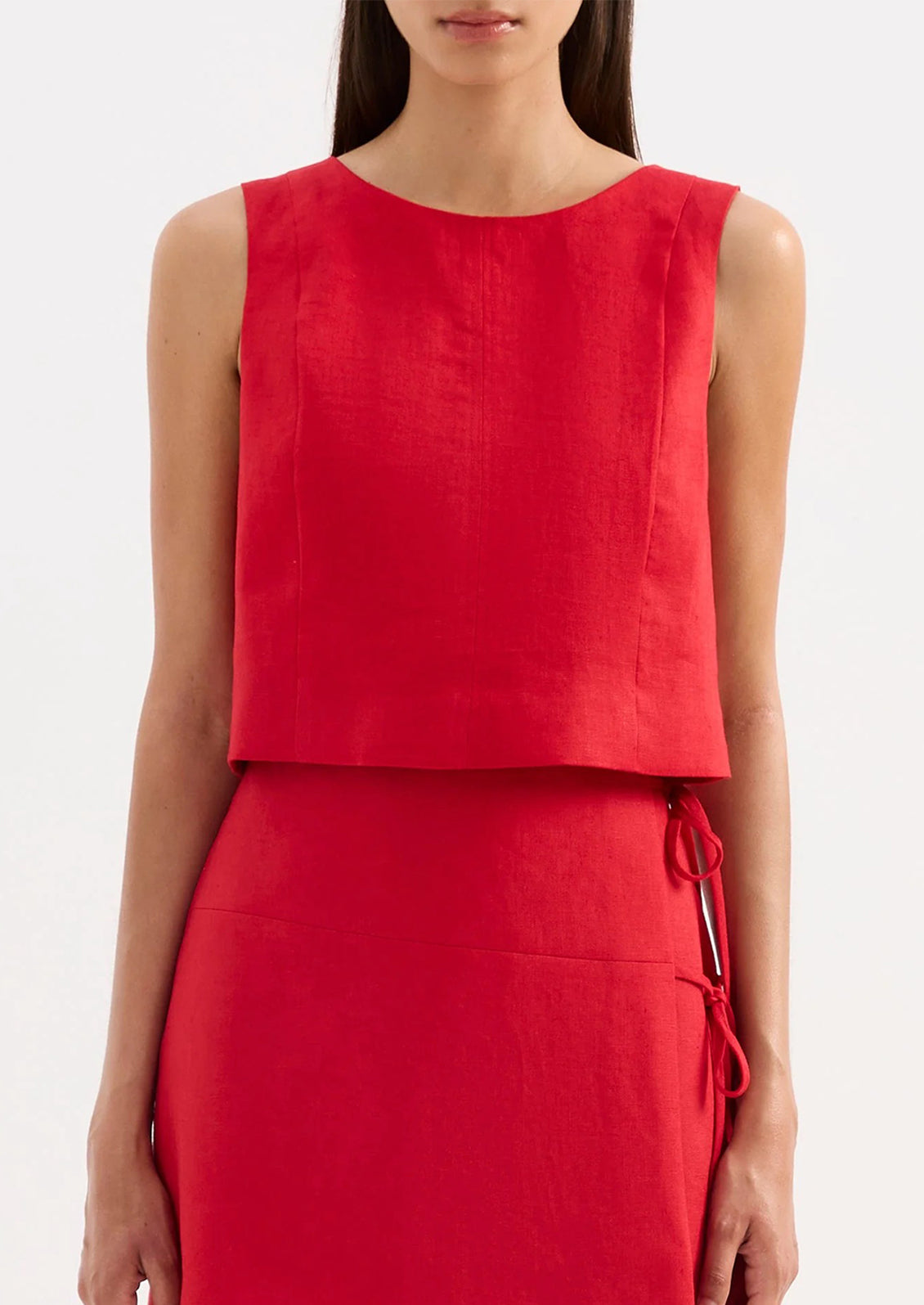Red sleeveless top and skirt set on a white background