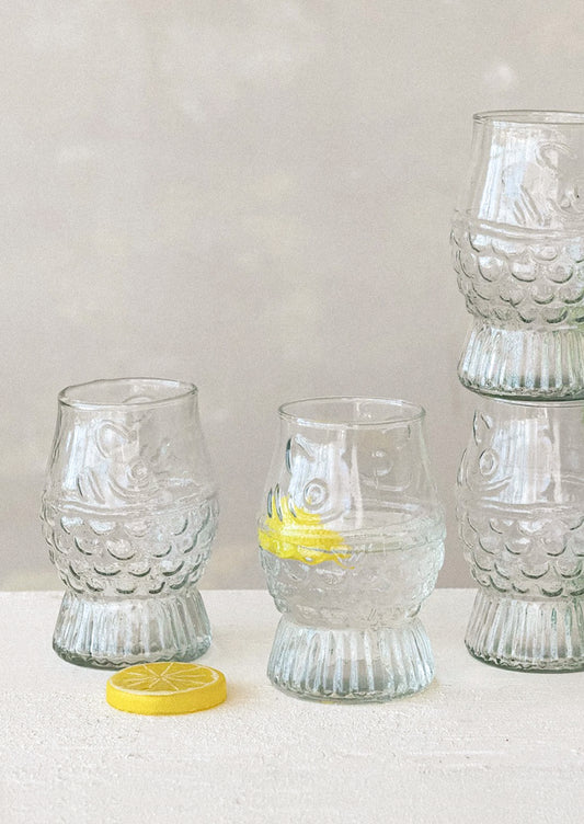 Clear glass tumblers with fish shape.