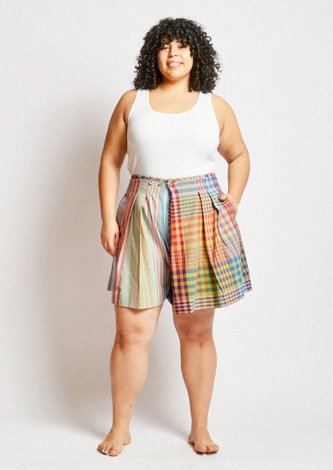 A person wearing a skort in colorful madras cotton.