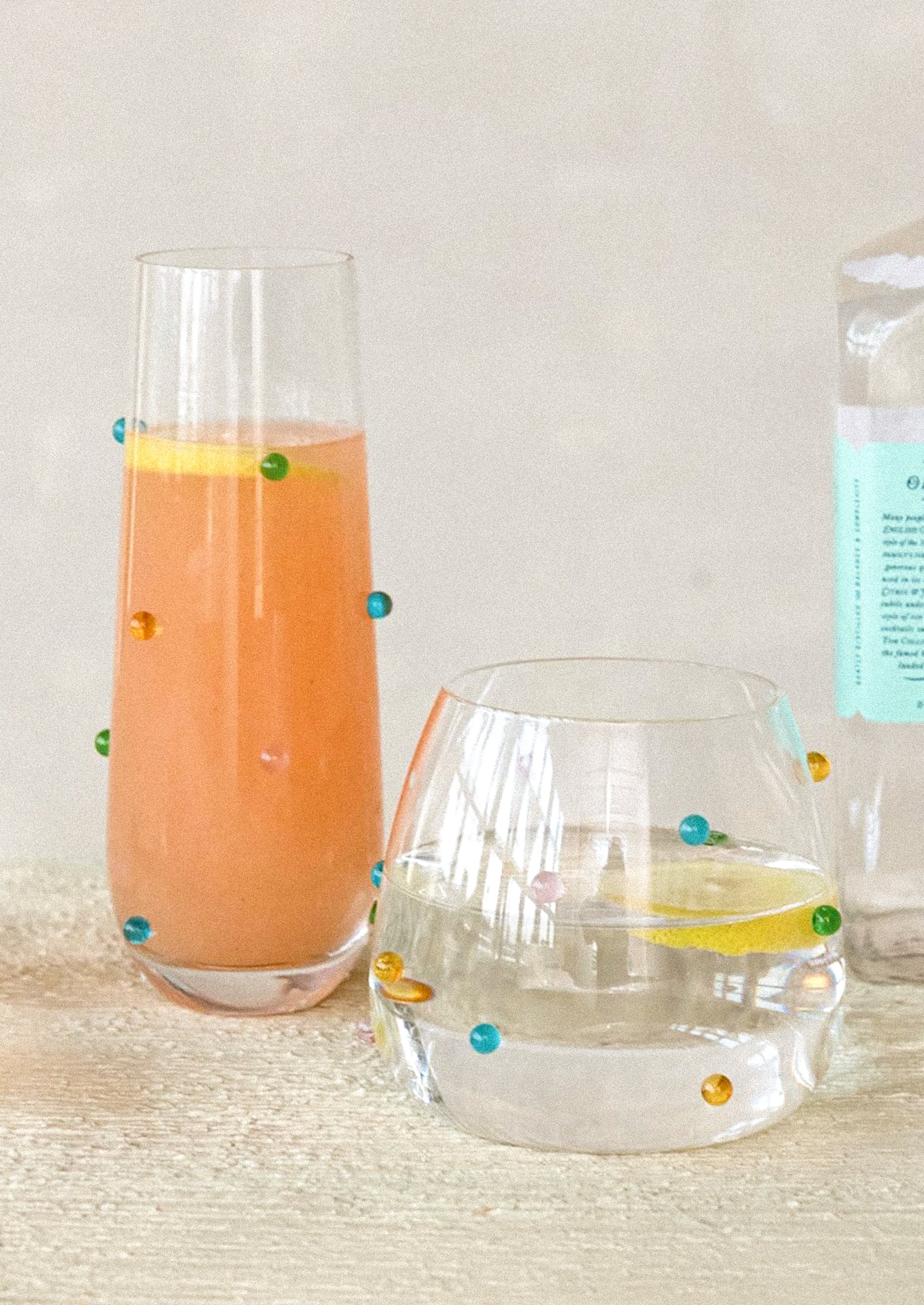 Clear glassware with colorful raised "dots" on outside of glass.