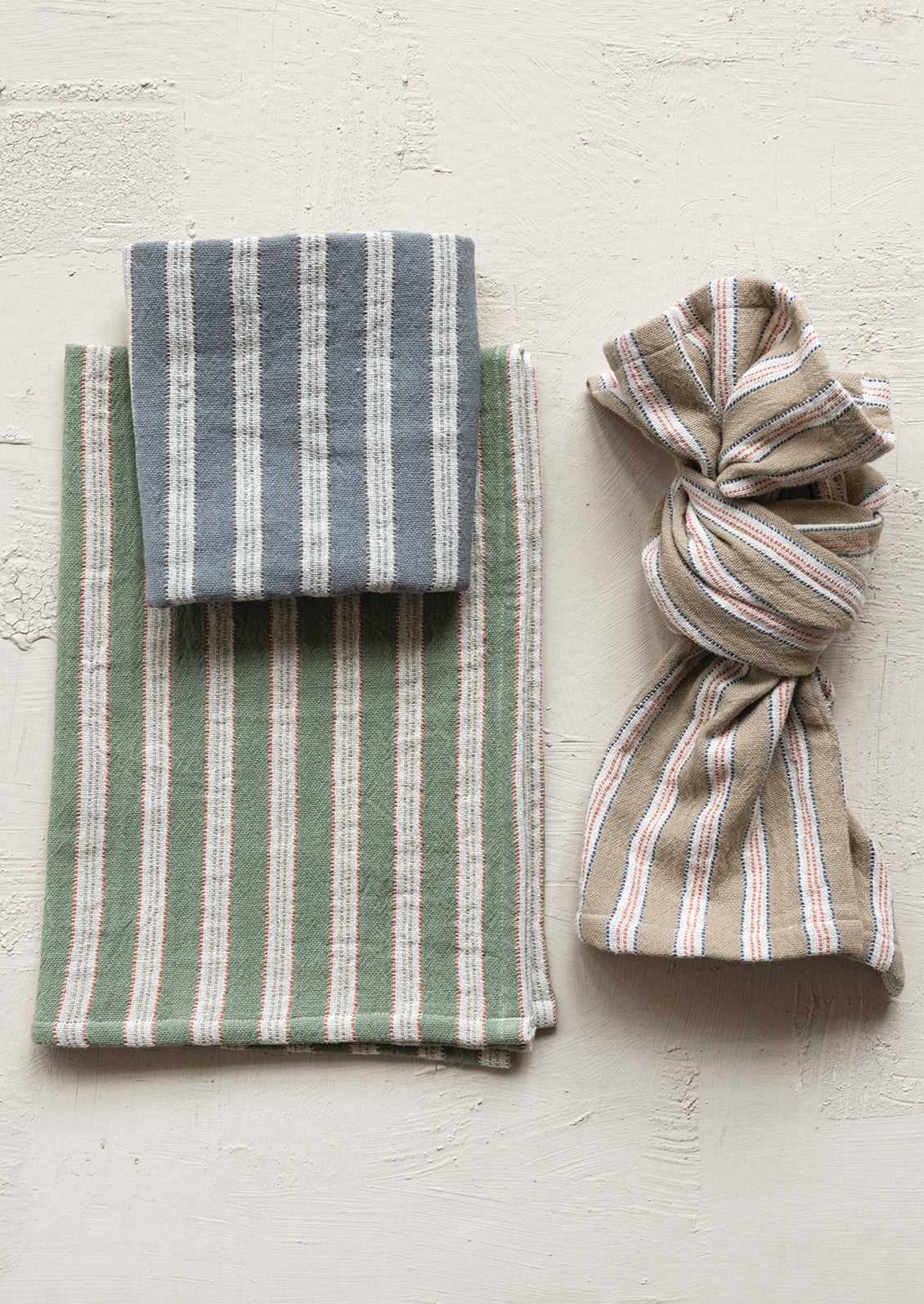 Striped kitchen towels in assorted colors.