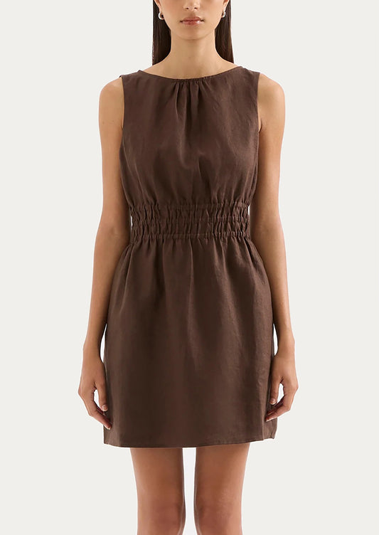 Brown dress worn by a model on a white background