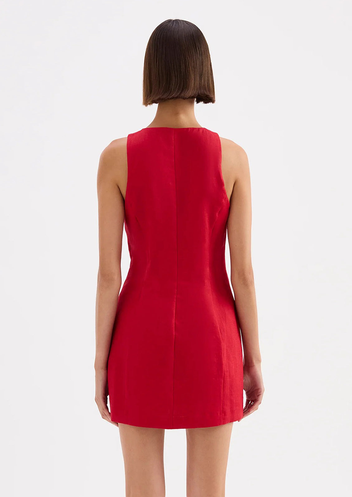 Red sleeveless dress with buttons on a white background