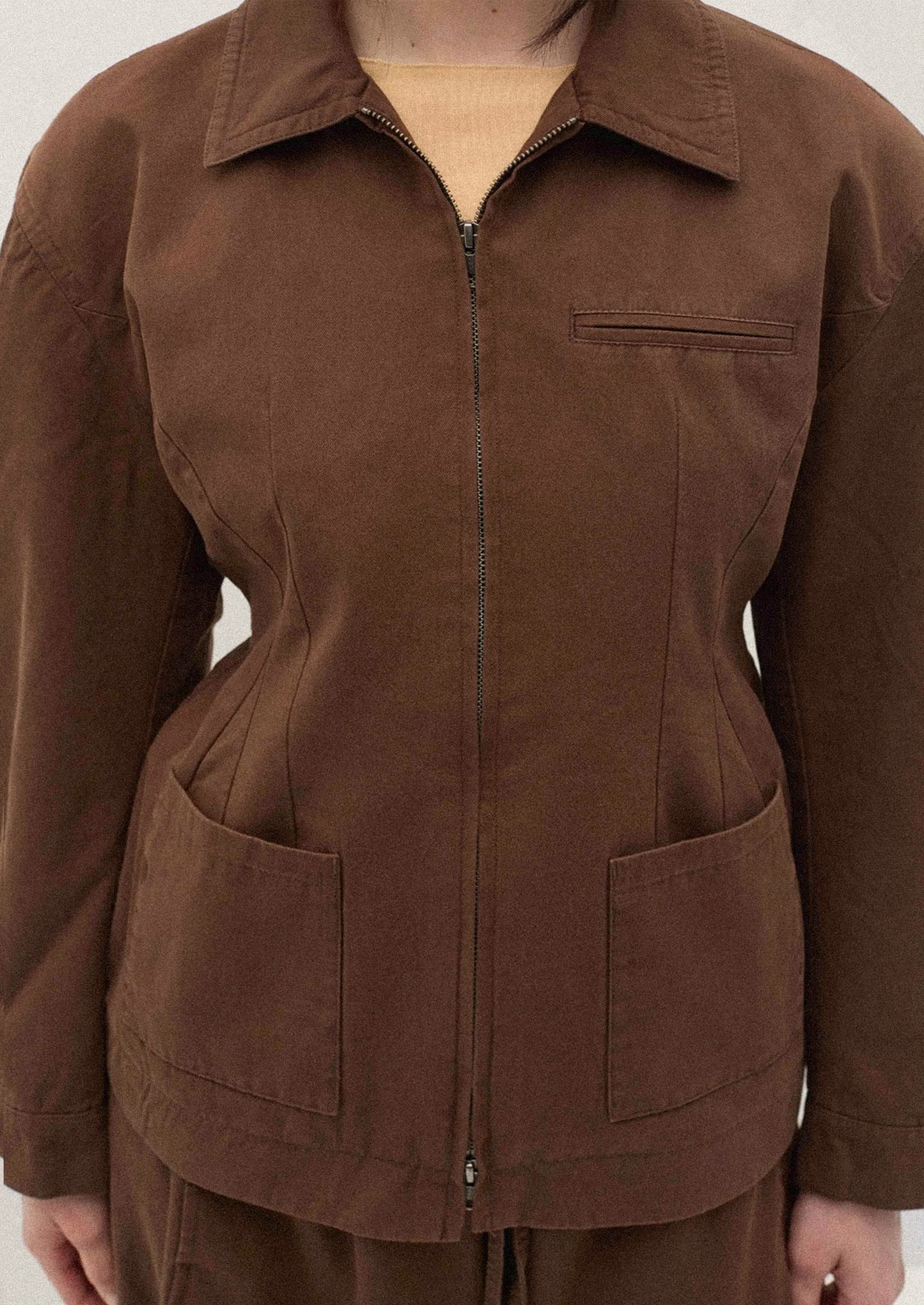 Brown jacket with a white background