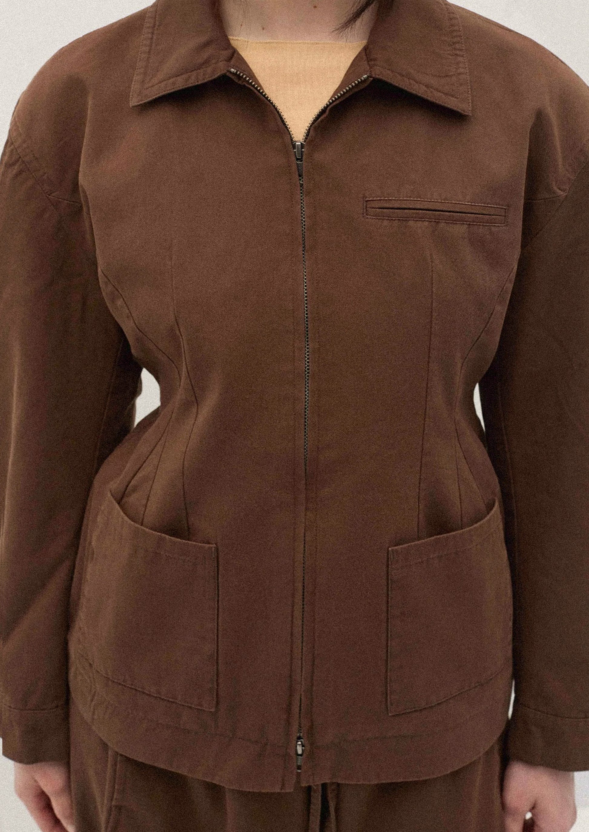 Brown jacket with a white background