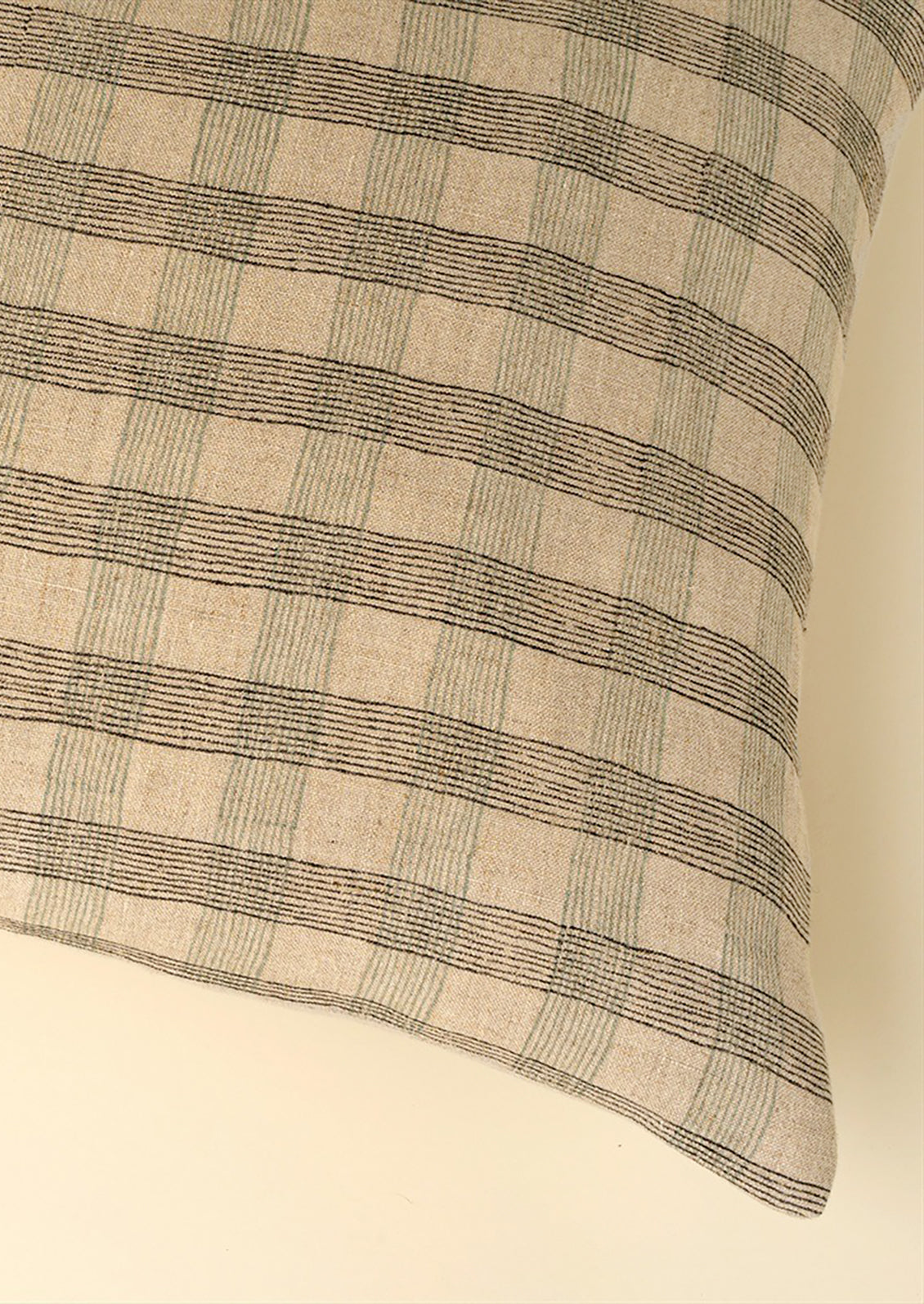 Plaid patterned natural linen pillow.