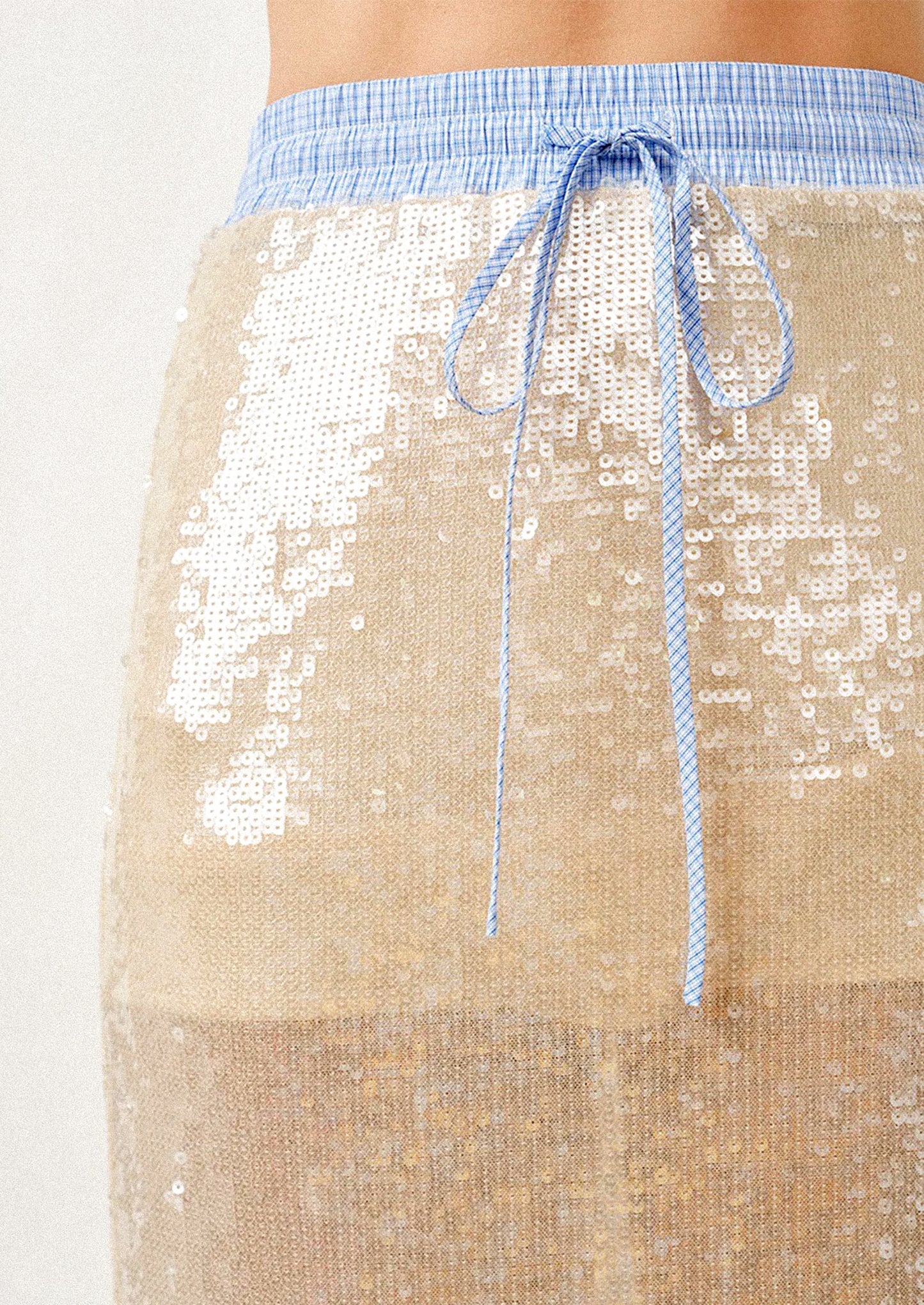 Champagne sequin skirt with blue drawstring on a white background