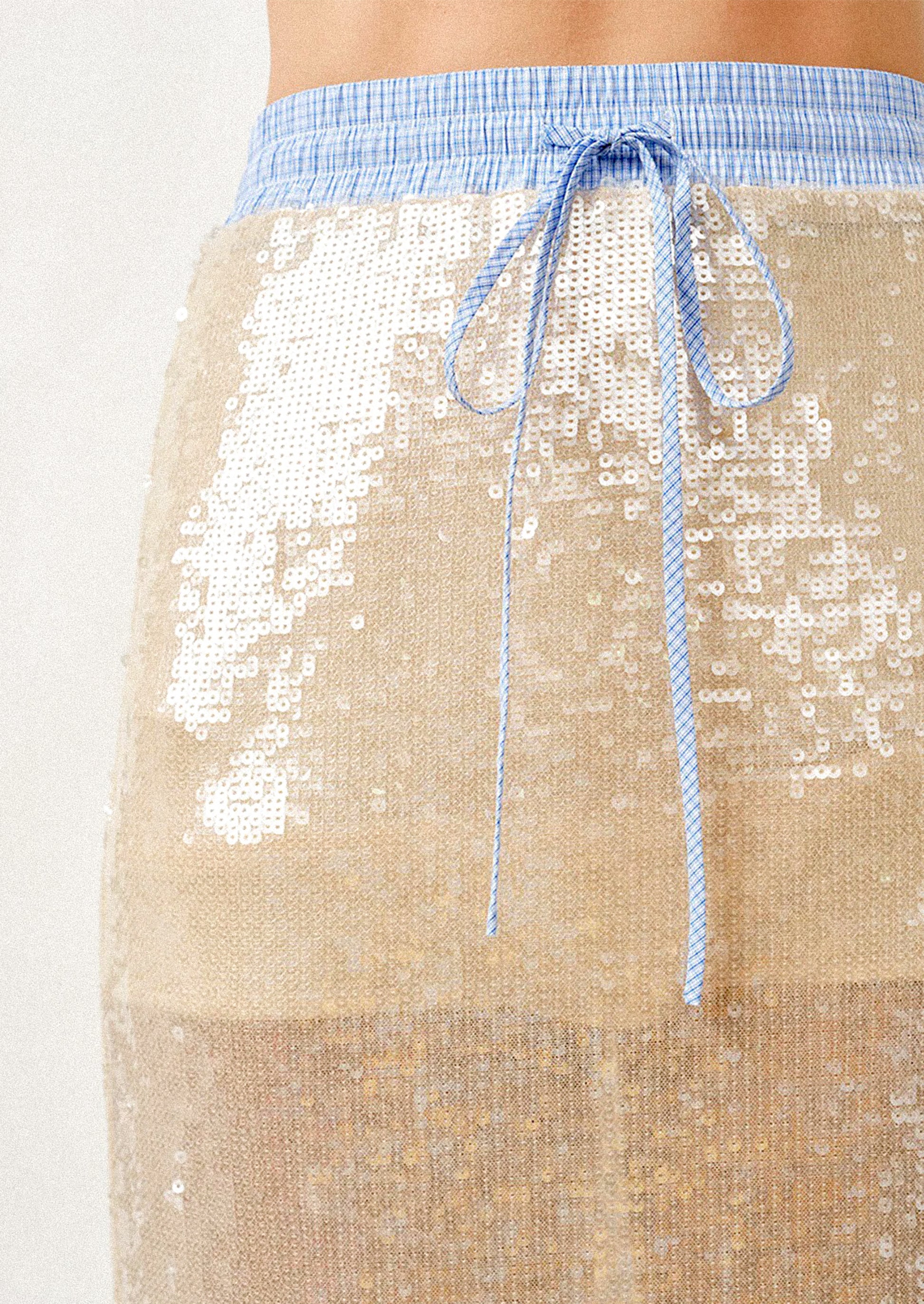 Champagne sequin skirt with blue drawstring on a white background