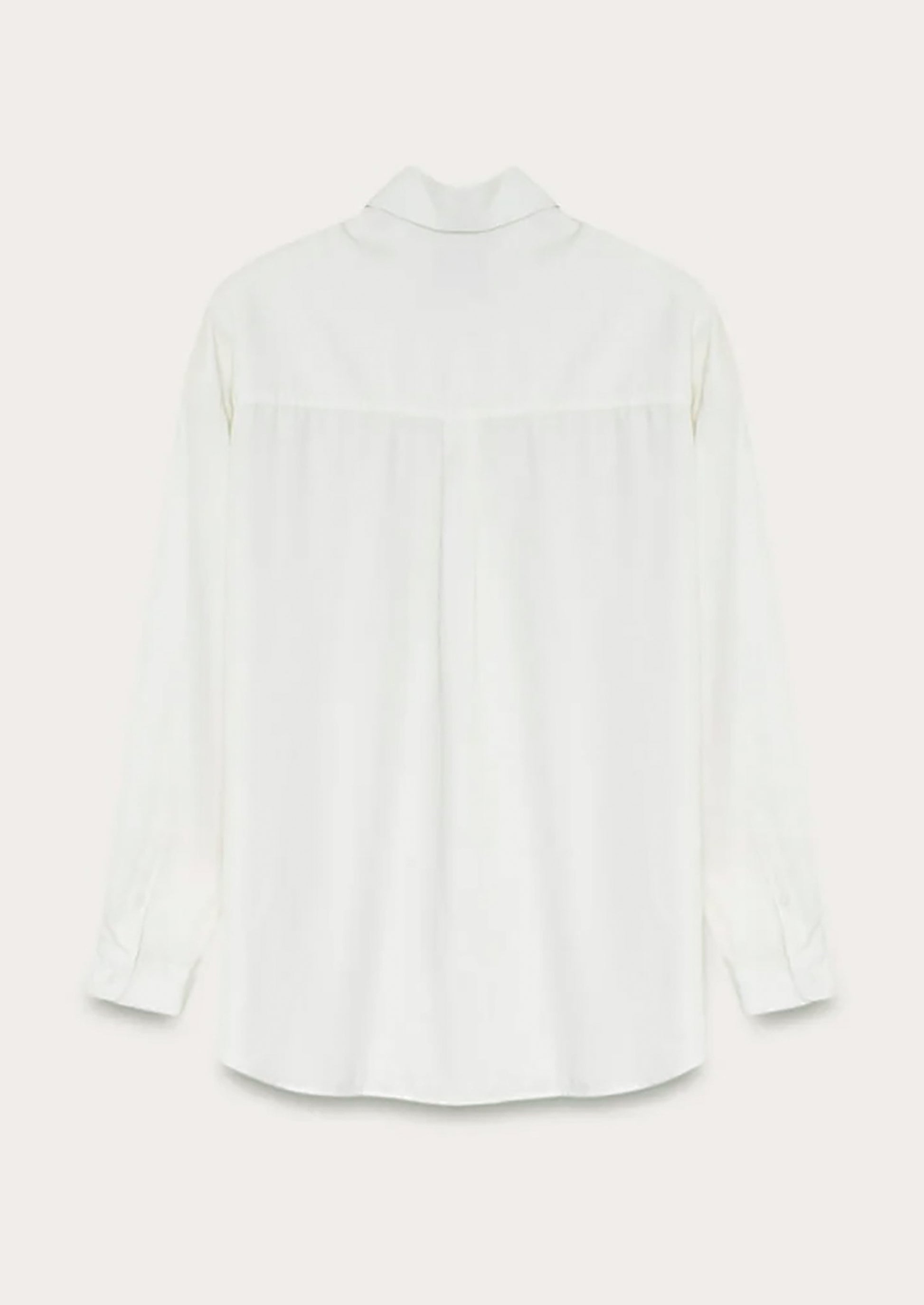 A white button front shirt with gathered back yoke.