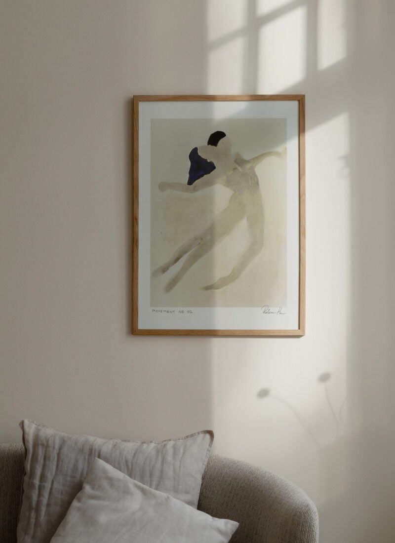 Framed artwork of a couple embracing on a wall with soft lighting