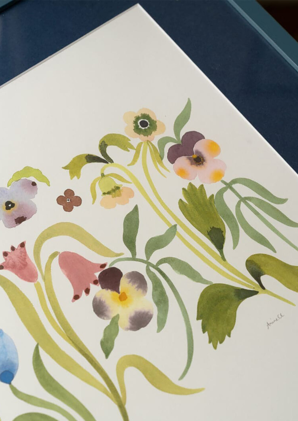 Floral artwork with colorful flowers and green leaves on a white background
