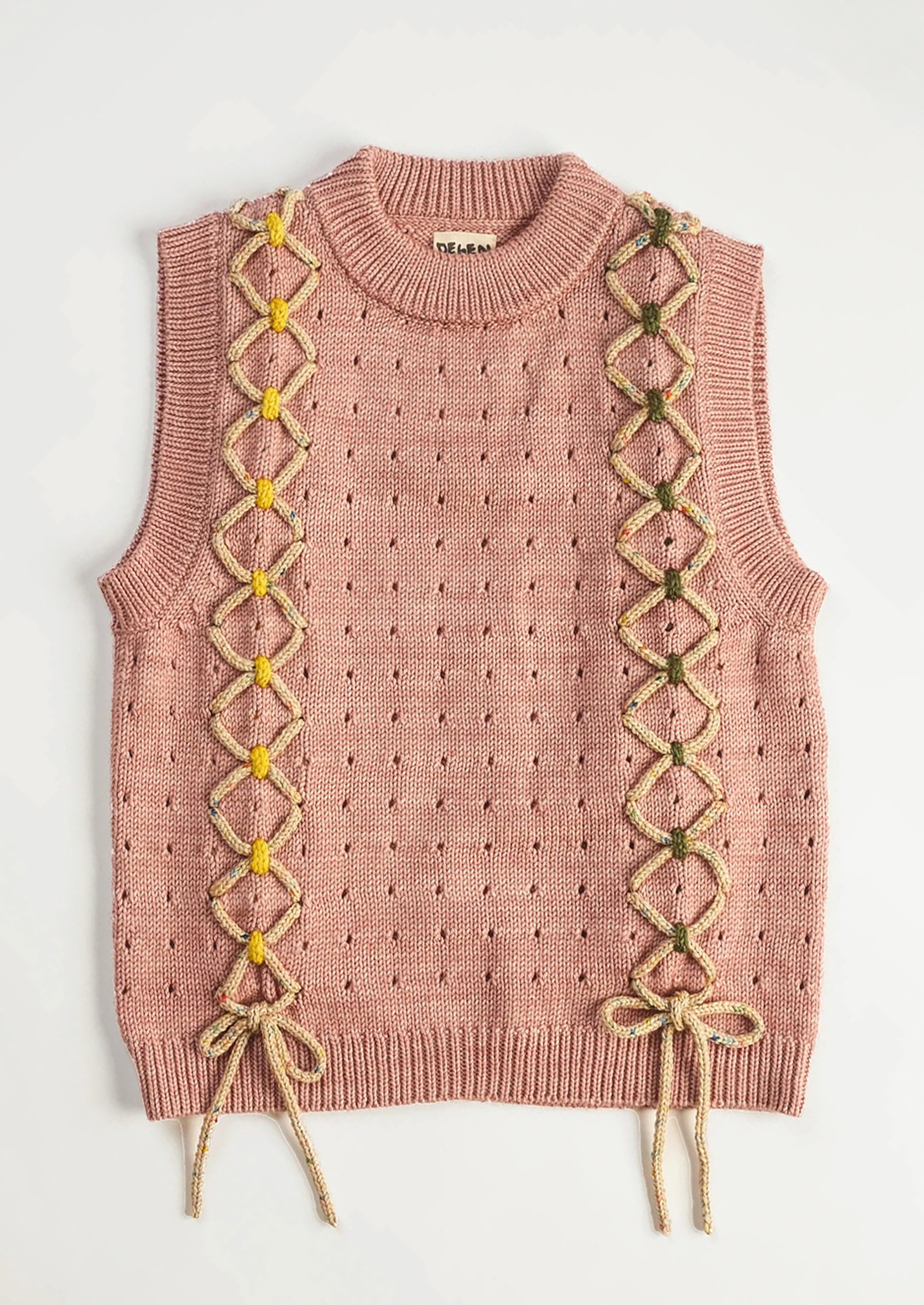 Pink knitted vest with lace-up front design on a white background