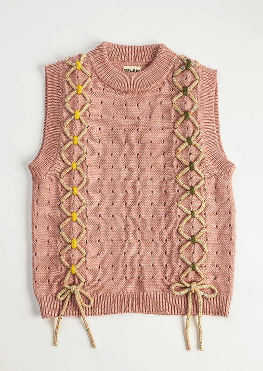 Pink knitted vest with lace-up front design on a white background