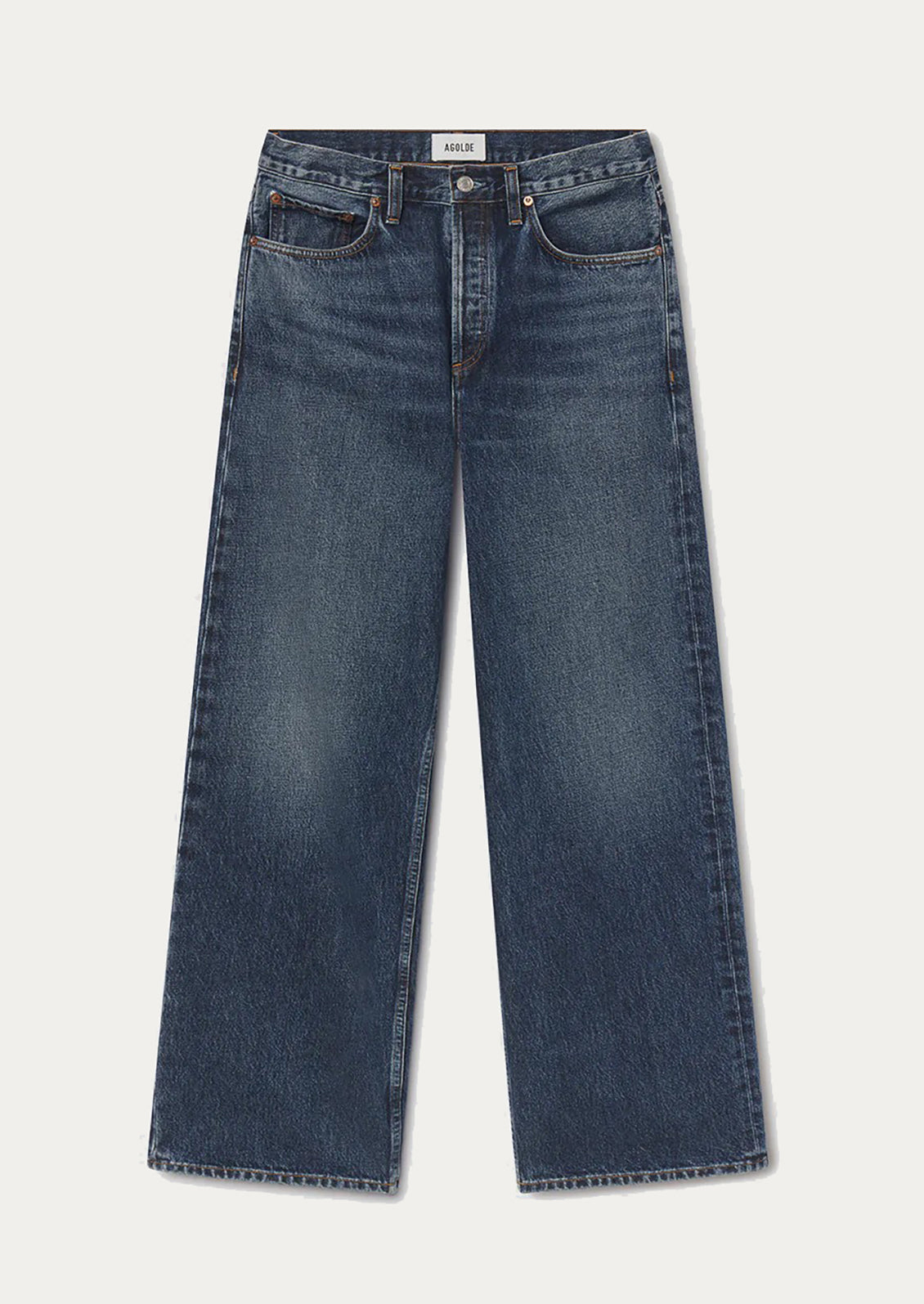 A pair of dark blue denim jeans with a straight-leg fit, laid flat against a light off-white background. The brand name 'Agolde' is visible on the inner waistband label.